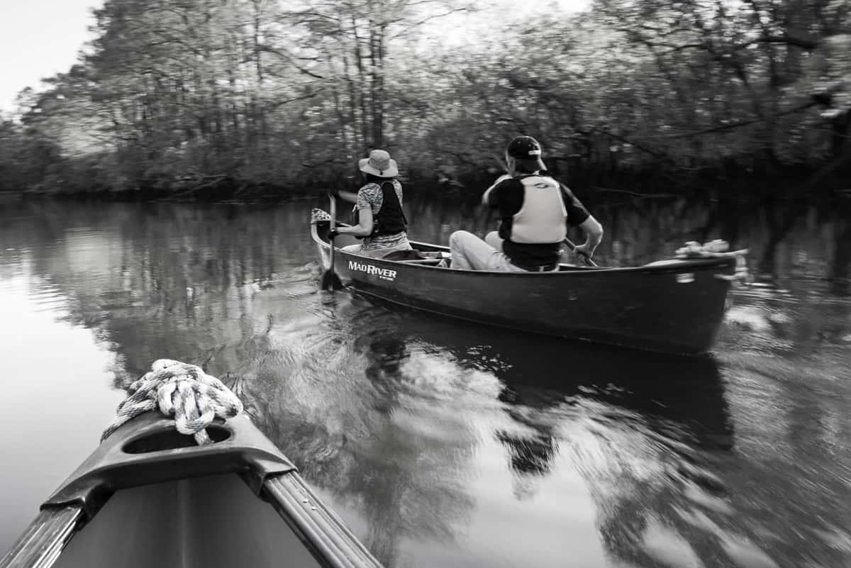 Paddling the Black River in canoes